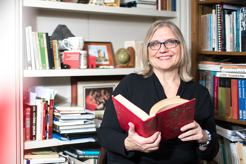 Karen Sorenson poses for photo in her office