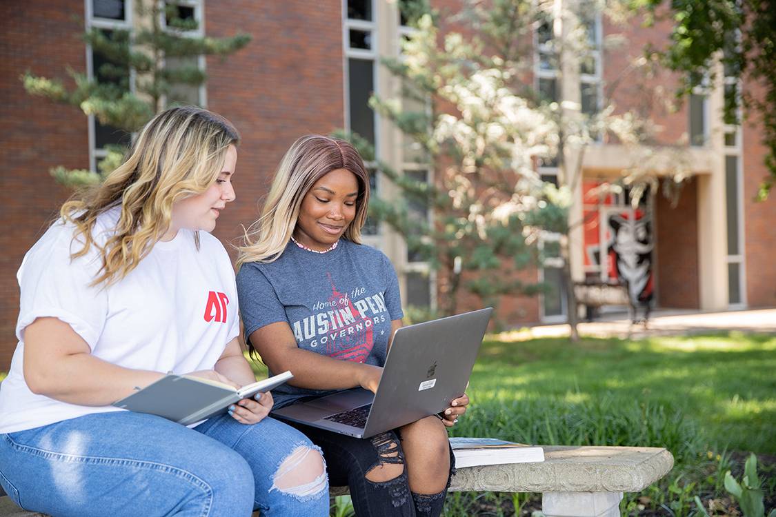 Students studying outside Claxton building