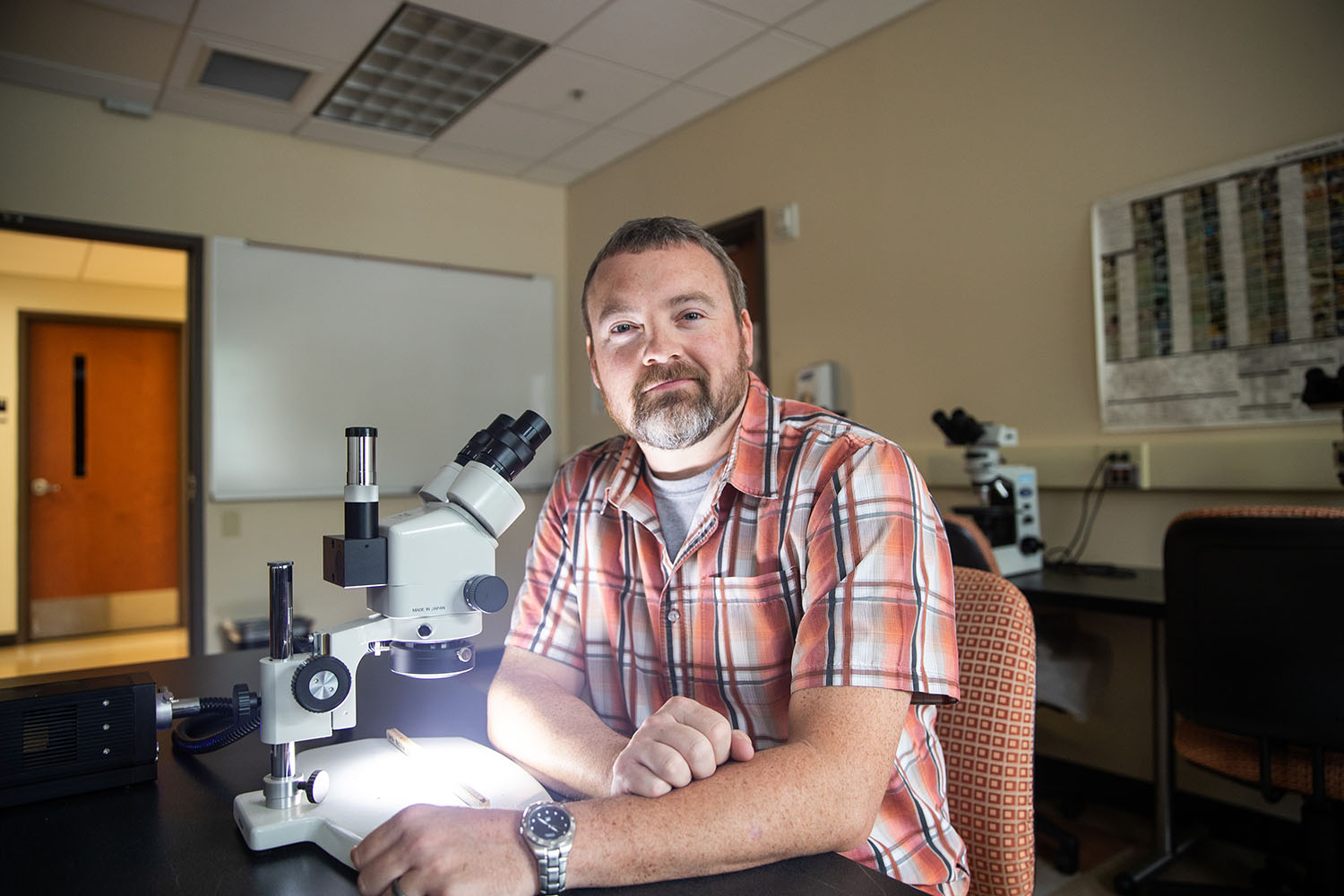 Chris Gentry poses for photo in McCord lab