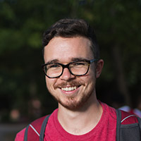 Nicholas Lee poses for photo outside of Harned building