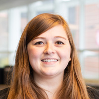 Robyn Yates poses for photo in Maynard building