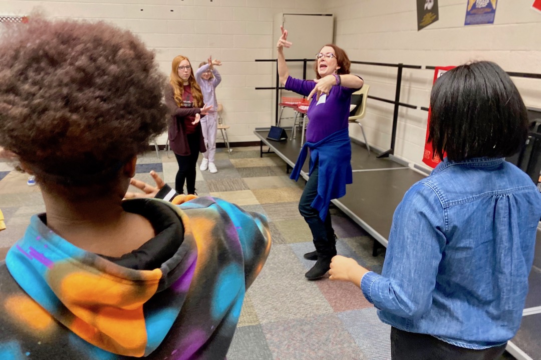 Kennedy Center Teaching Artist Cissy Whipp helps students at West Creek Middle School with their choreography.