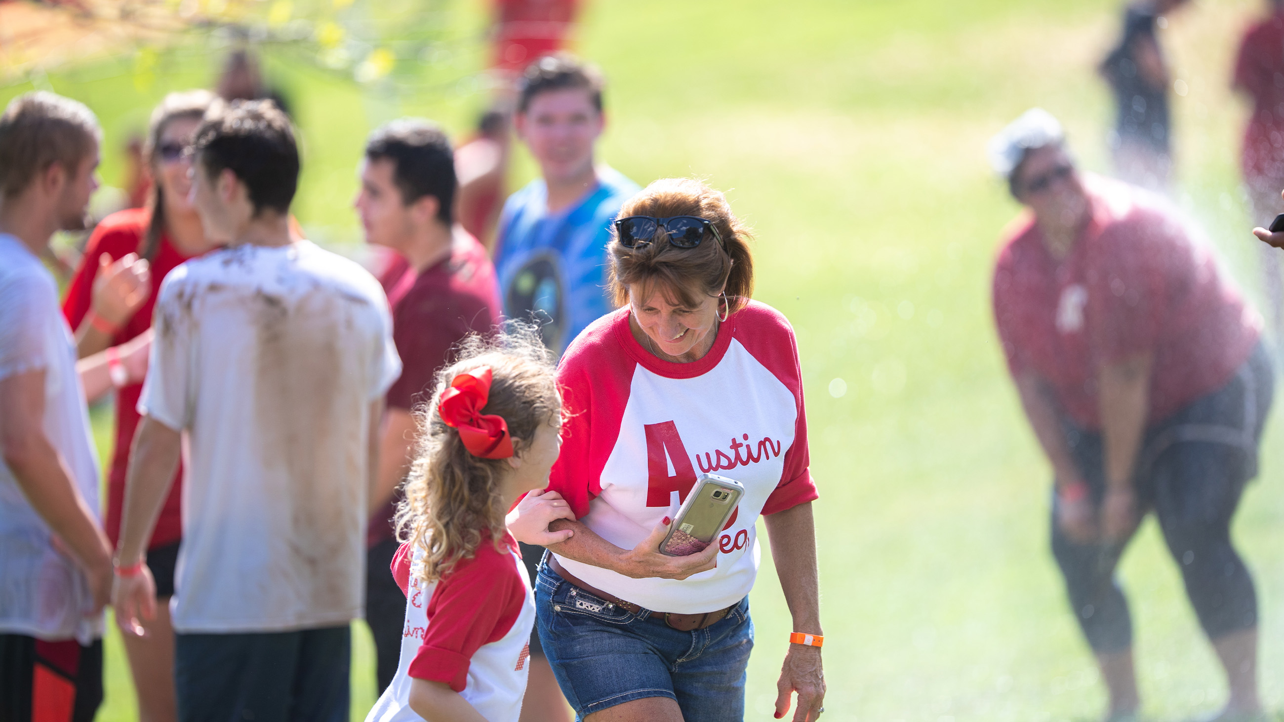 Family spending time at an outside Austin Peay event