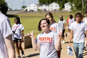 Freshman posing for a picture on their way to their service project