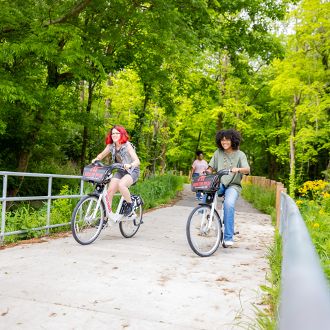 Students riding bikes on the Greenway