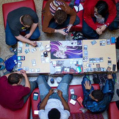 An aerial shot of a group of students playing a game of dnd.