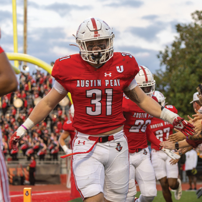 Football player running onto the field