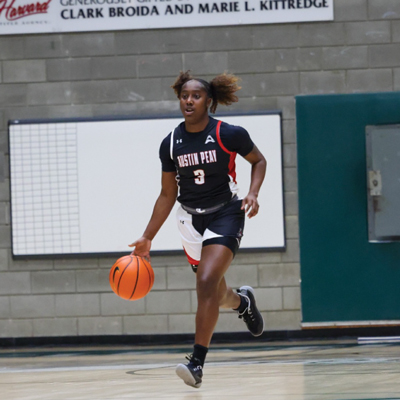 Player dribbling the ball while running down court.