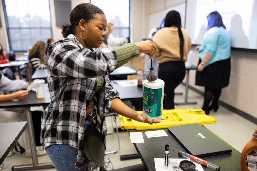 student in a fingerprint class