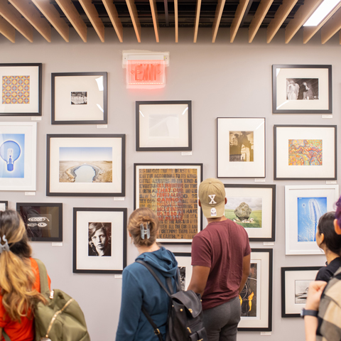 Students looking at gallery art