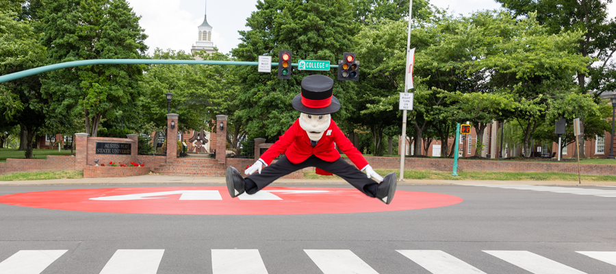 Gov Mascot jumping and touching his toes