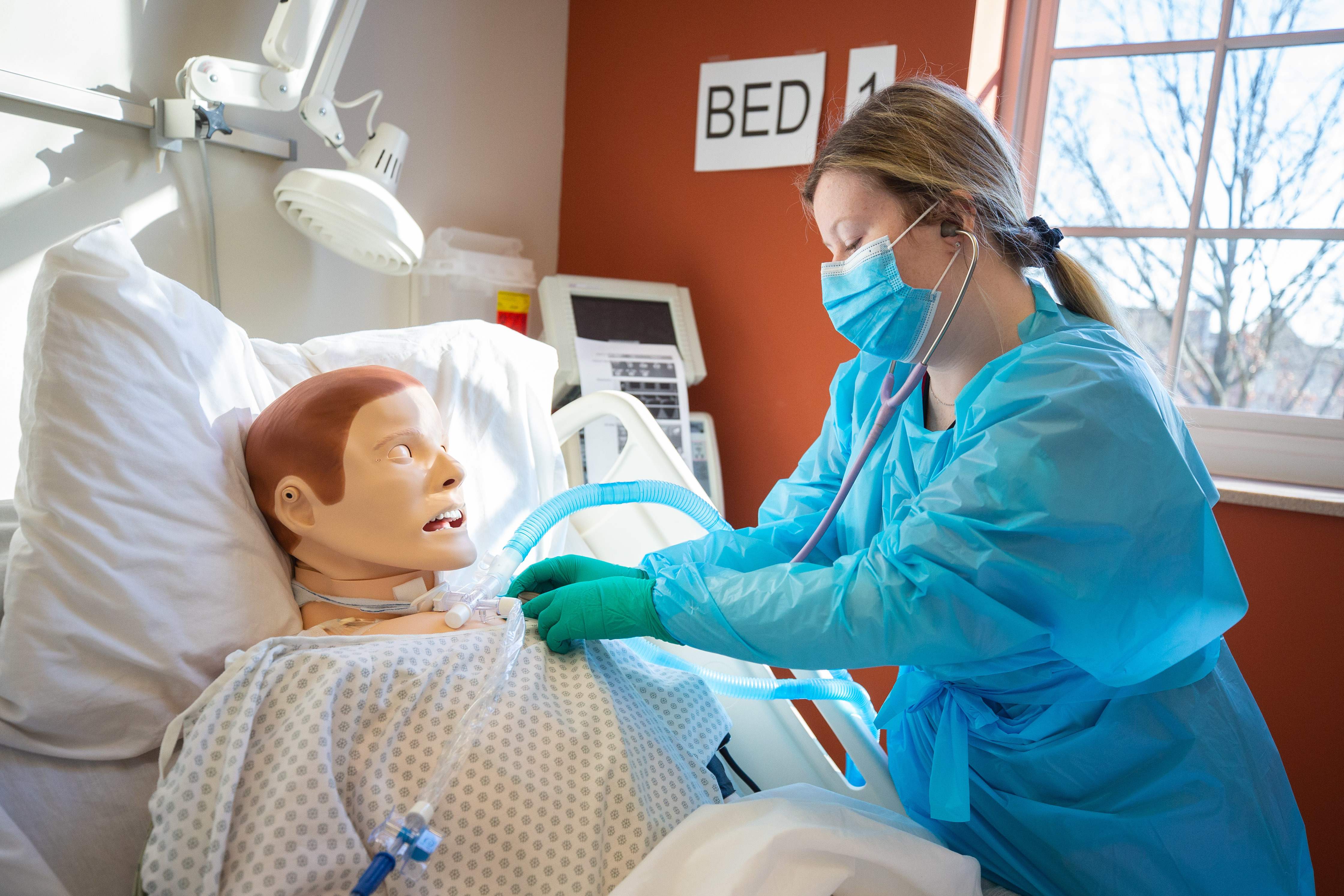 Nursing student works on medical dummy