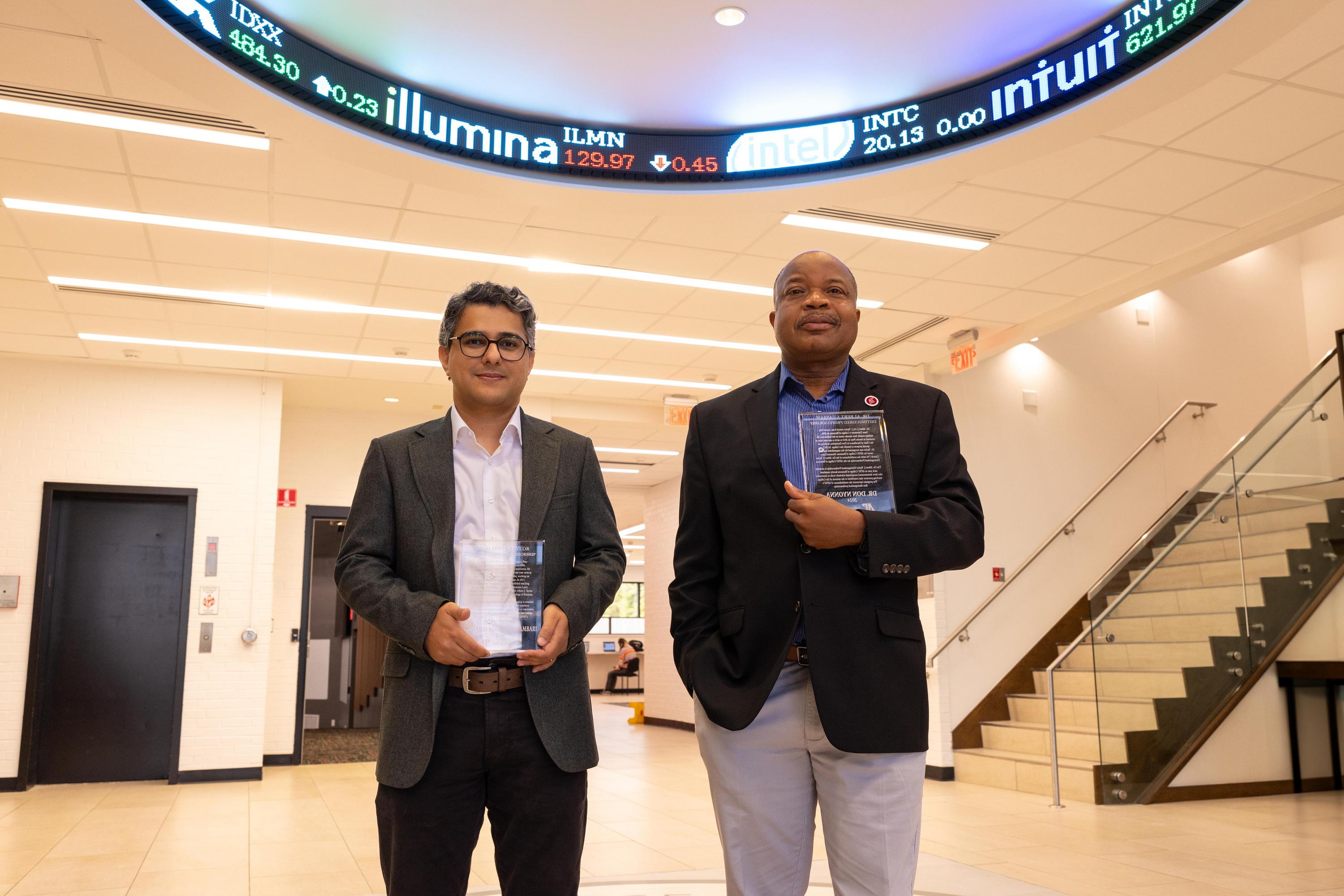 photo of faculty recipients of the 2024 AJ Taylor Awards pose in the lobby of the Kimbrough Building