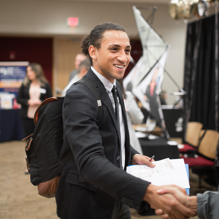 Student talking with employer at Career Fair