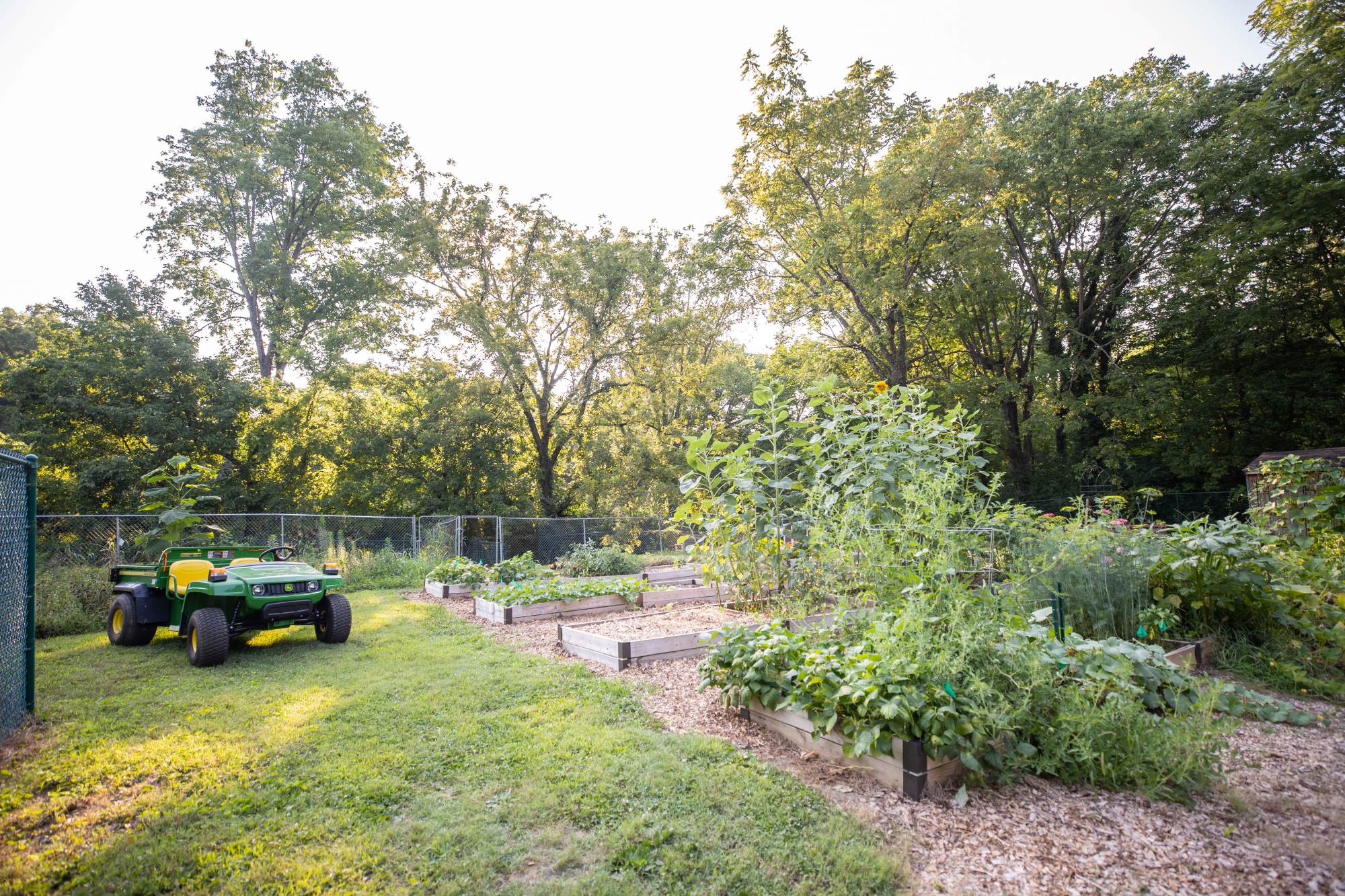 A john deer gator parked at the oec garden.