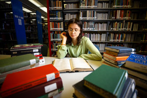 student working in the library