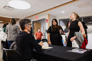 Students talking to a professor