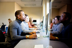 Student working at a computer in class