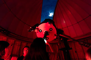 Students looking through a telescope