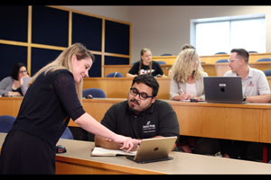 Teacher working with a student in class