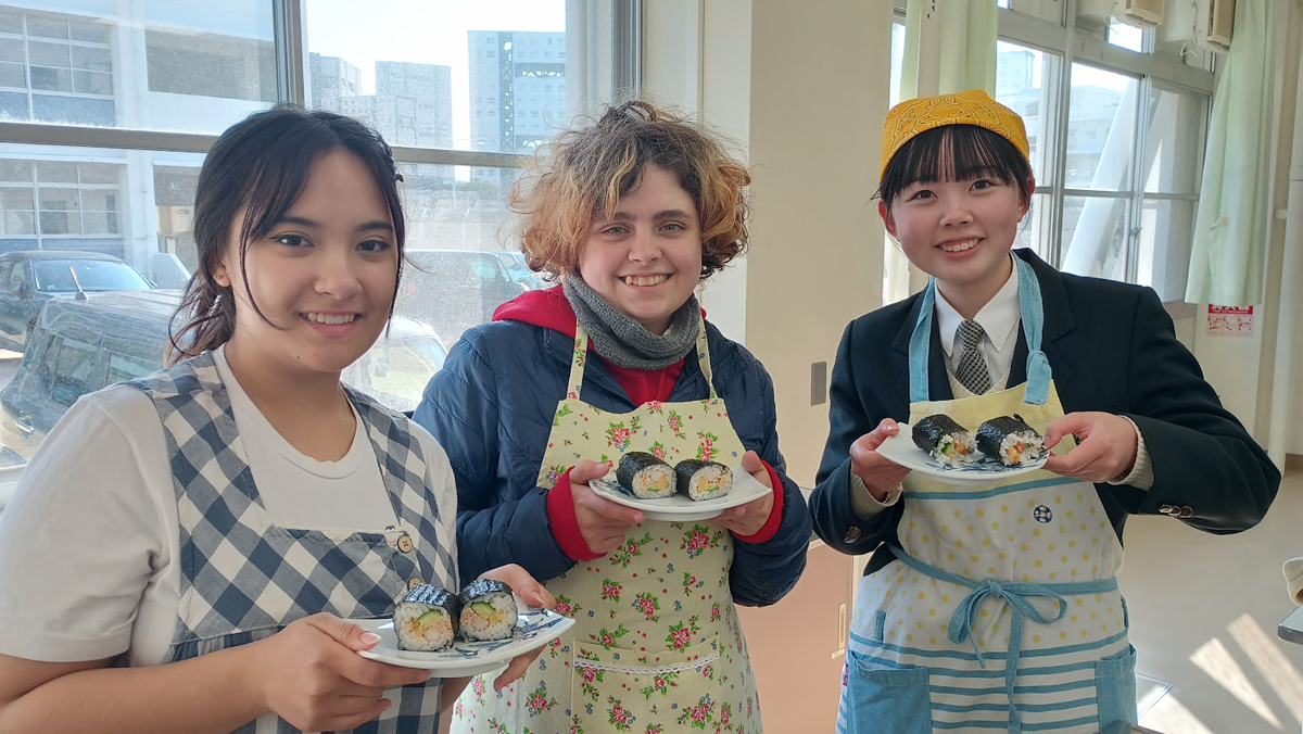 Students showing off their sushi making skills. 