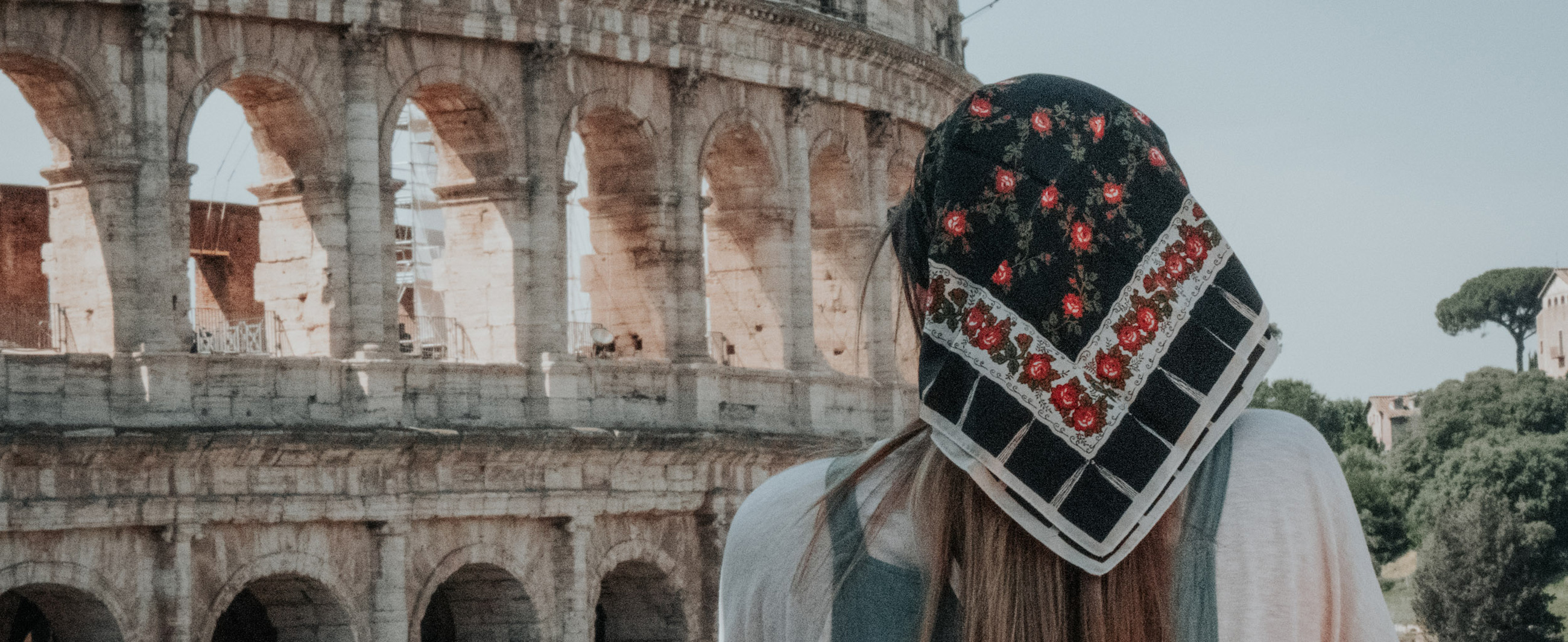 Student in Italy, looking at the colosseum. 