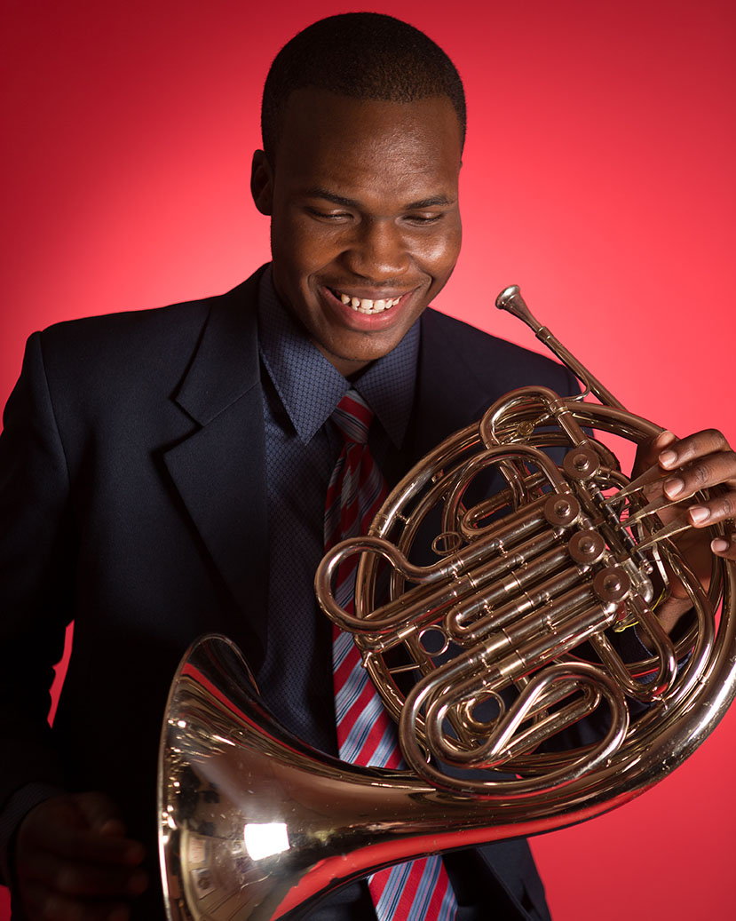 Emmanuel Méjeun poses for photo with French Horn