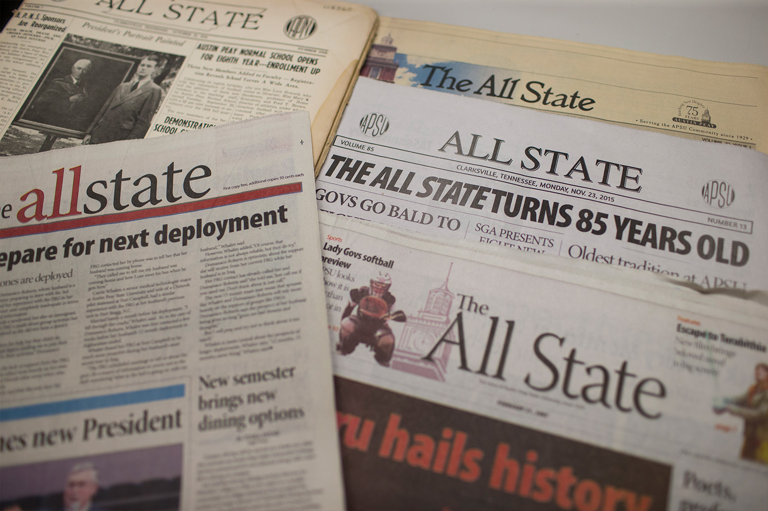 The all state newspapers sit on desk