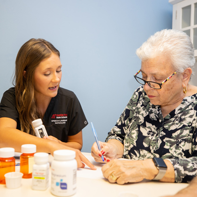 Clinician working with an patient on their medication