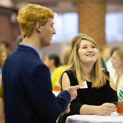 Students talking at a networking event