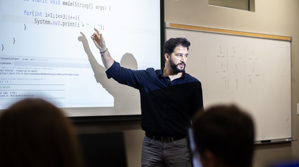 Computer Science Teacher instructing the class