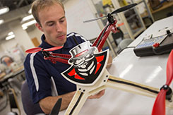 Student works on drone