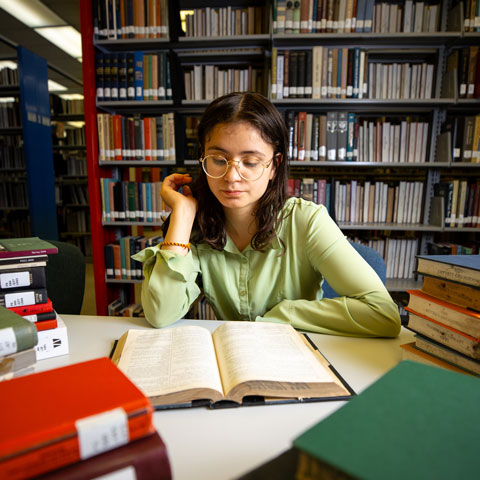 Student studying with books