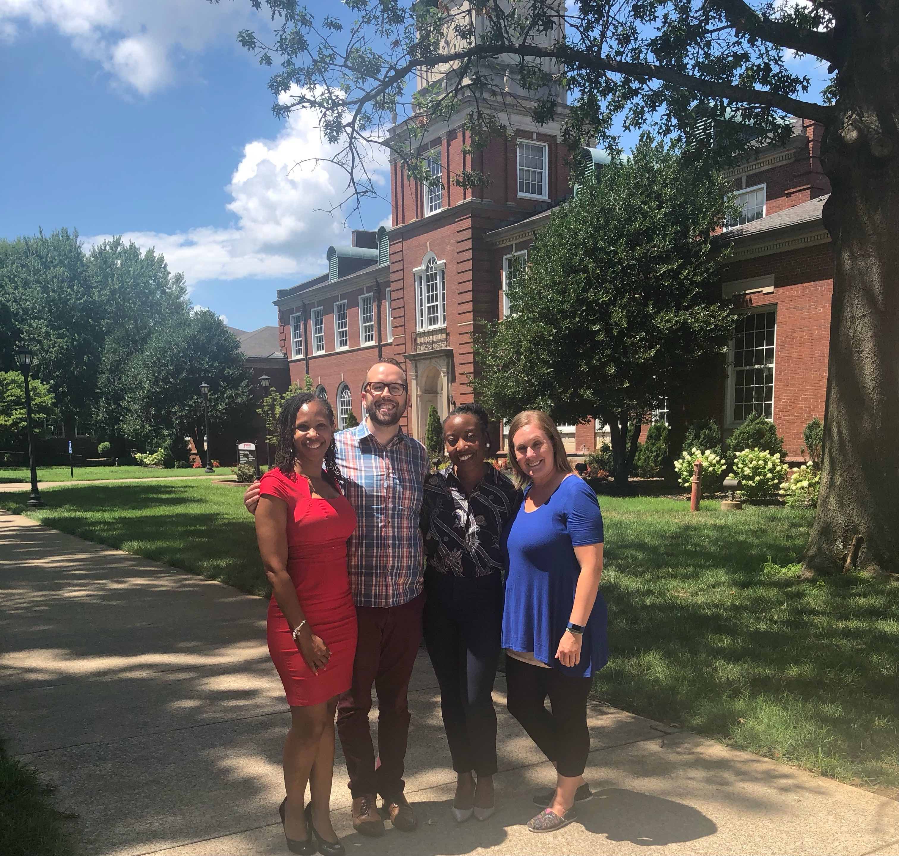 photo of Dr. Gibson, Dr. Toomey, Dr. Fripp, and Dr. Coggins standing in front of the Browning Building on APSU campus