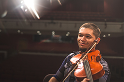 student plays violin in Mabry Concert Hall