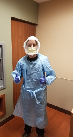 Hunter Burkhart gives thumbs up while wearing his personal protective equipment at Vanderbilt’s medical intensive care unit.