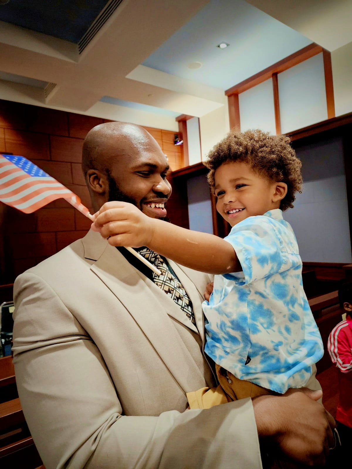 Emmanuel Méjeun celebrates with his 2-year-old son, Luka.