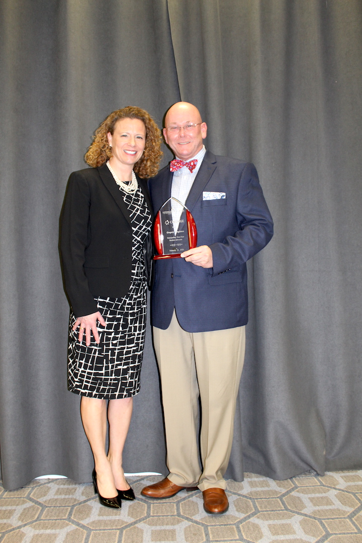 Jennifer Keup, Executive Director, National Resource Center for The First-Year Experience and Students in Transition, awards Austin Peay's Gregory R. Singleton, associate vice president of Student Affairs and dean of students, the Outstanding First-Year Student Advocate Award.