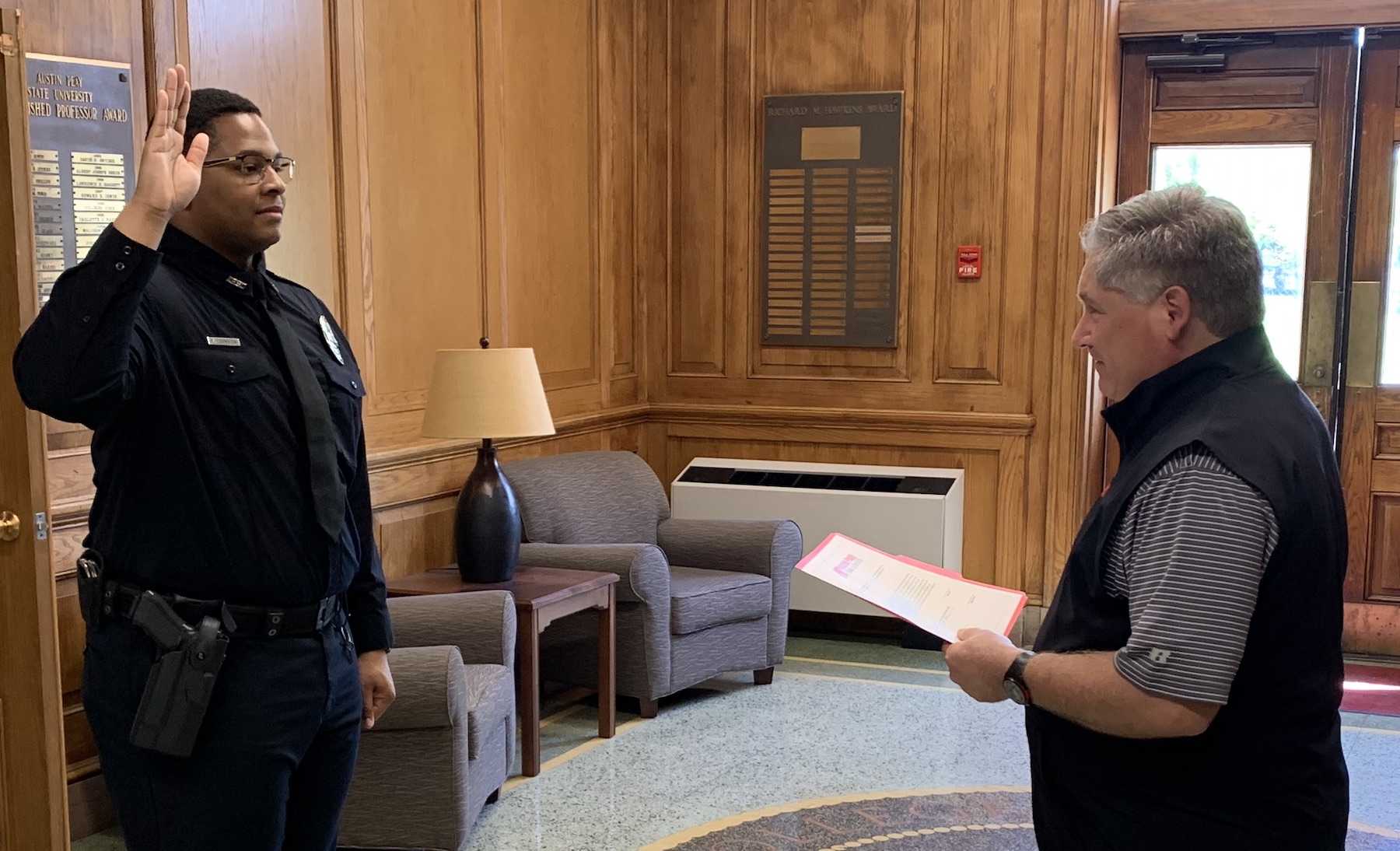 Officer Kameron Covington being sworn in by APSU President Mike Licari.