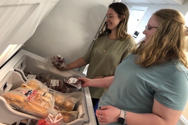 Students put donated meet into freezer