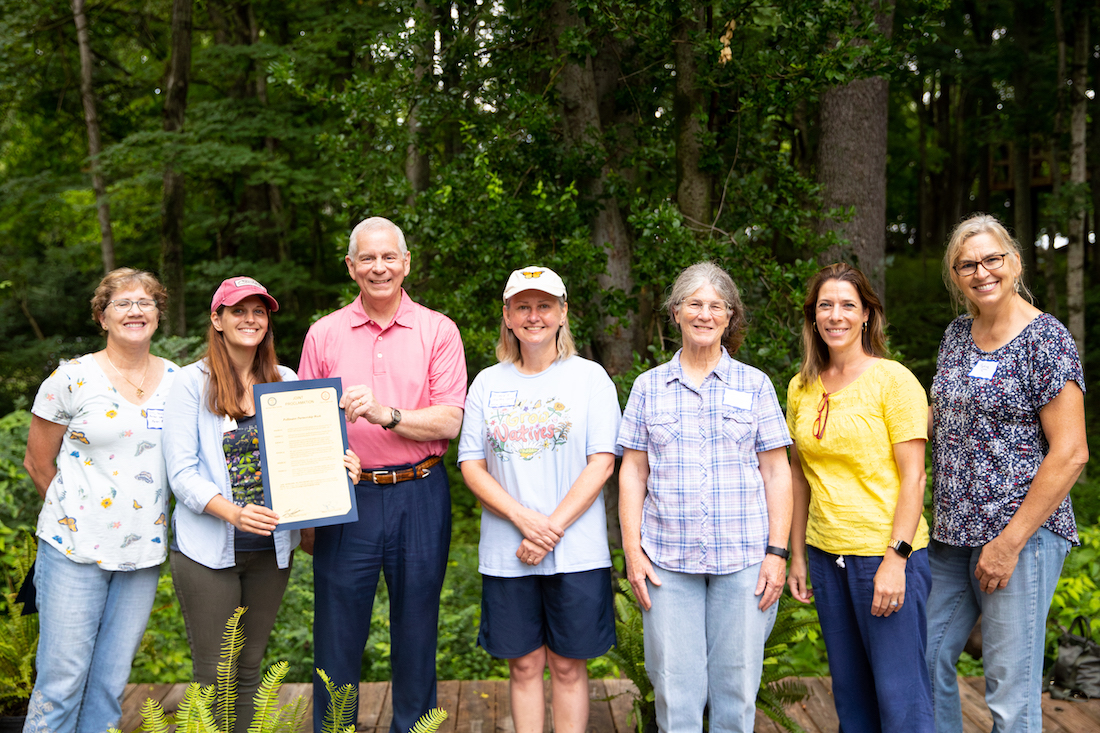 Clarksville Mayor Joe Pitts presents the Mayor's Monarch Pledge at APSU's Pollinator Week event.