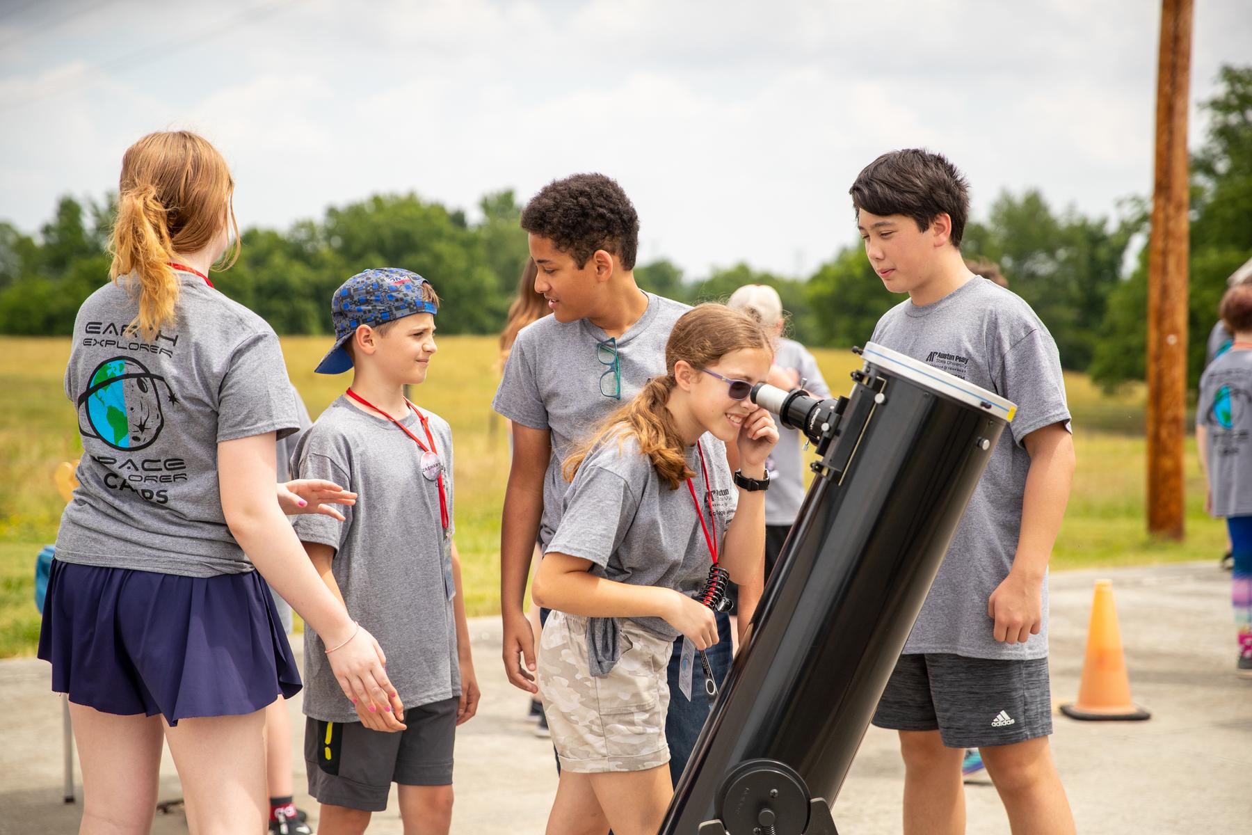 Students search for the sun through telescopes at APSU's Space Explorers Camp.