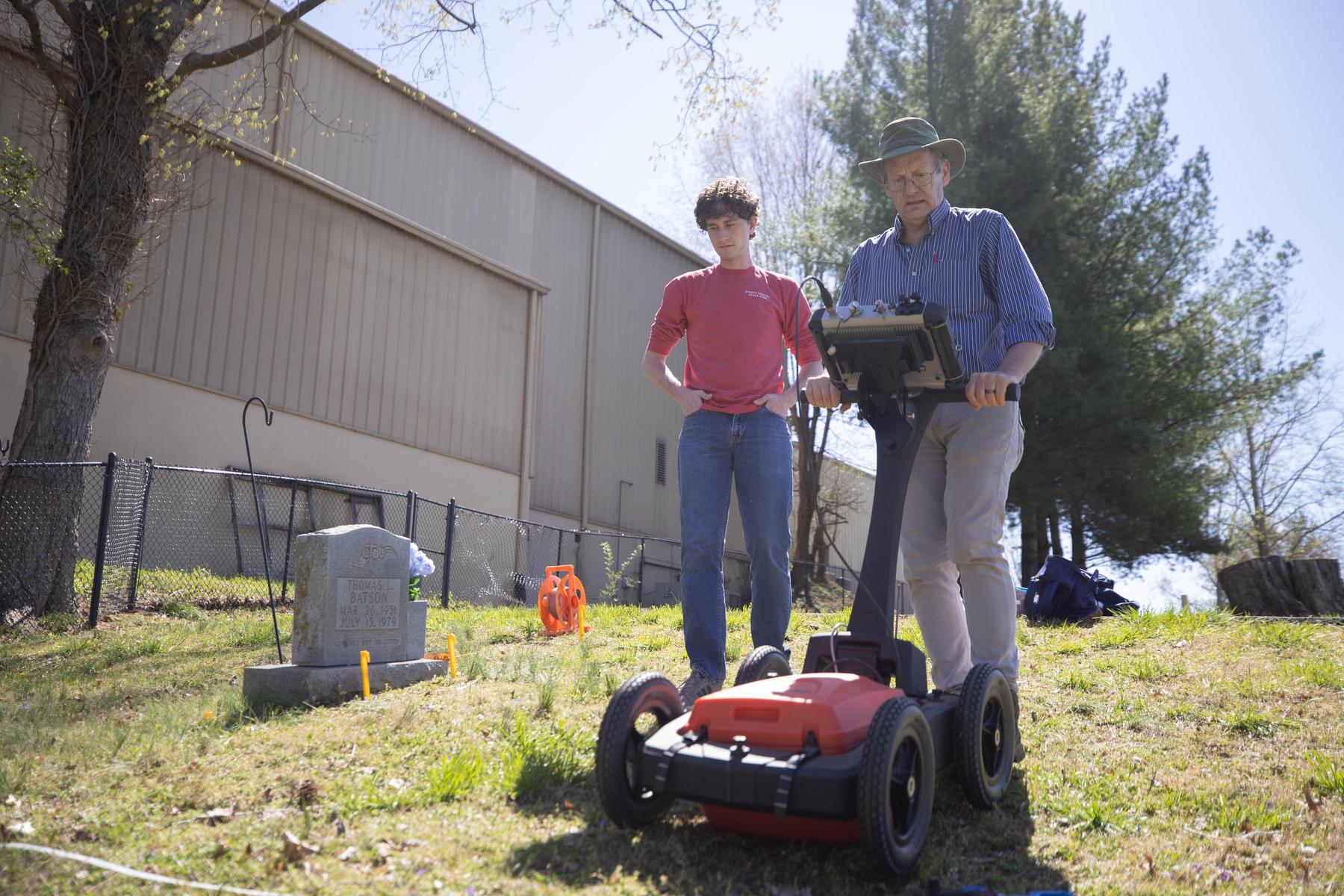 Dr. Daniel Frederick, professor of geology, operates a Ground Penetrating Radar (GPR) at Riverview Cemetery.