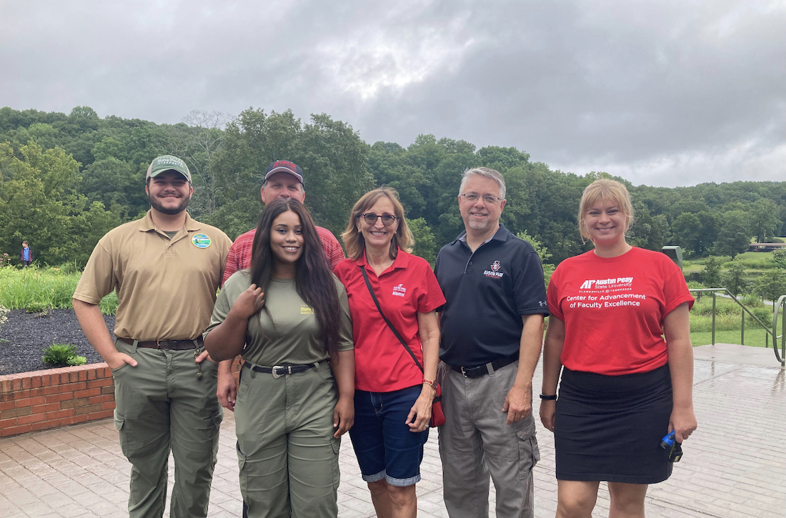 Graduate history student Ifunanya Ejimofor leads a tour group of APSU employees through Dunbar Cave State Park.