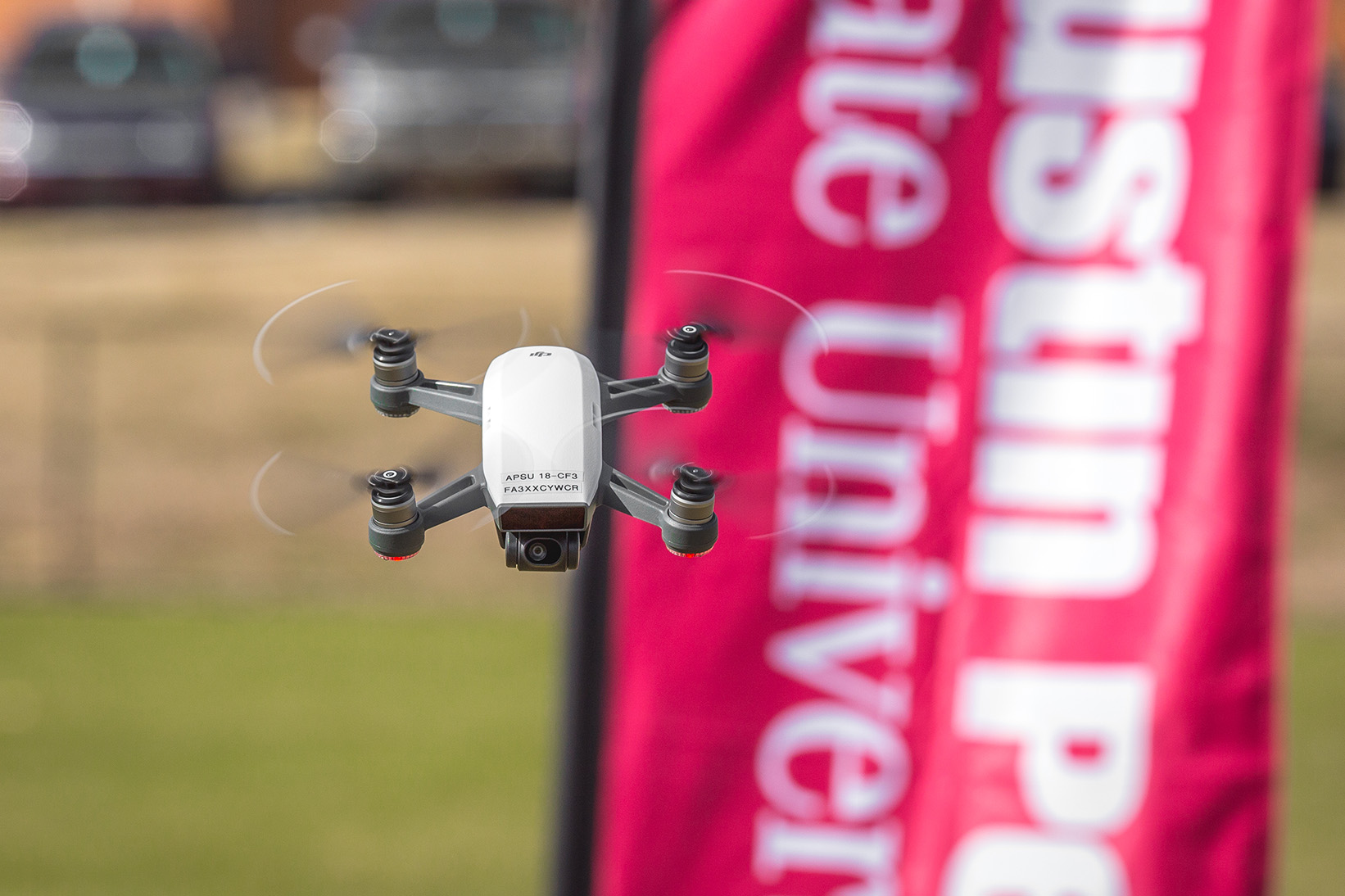 flying drone in front of dunn center