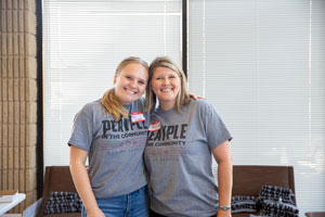 Student and staff member posing for a picture 