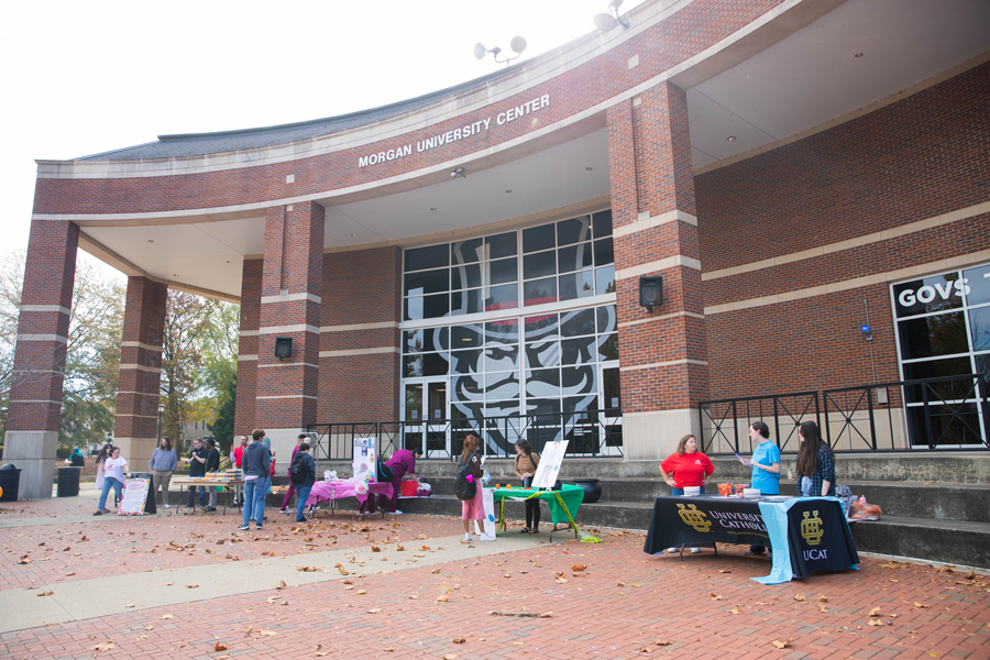 Tables set up in the UC plaza during First Friday Event