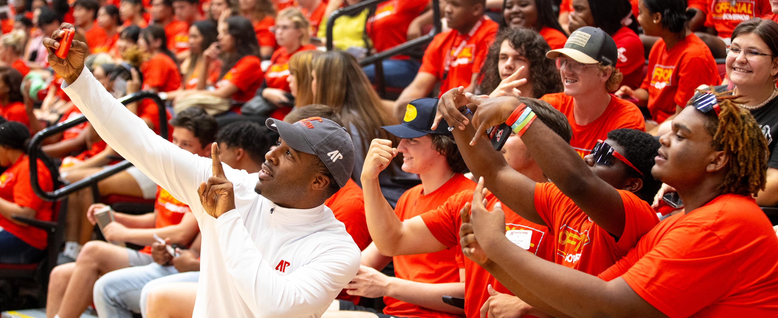 Dr Clemons posing for selfie with students