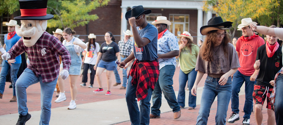 Students Square Dancing in the MUC Plaza