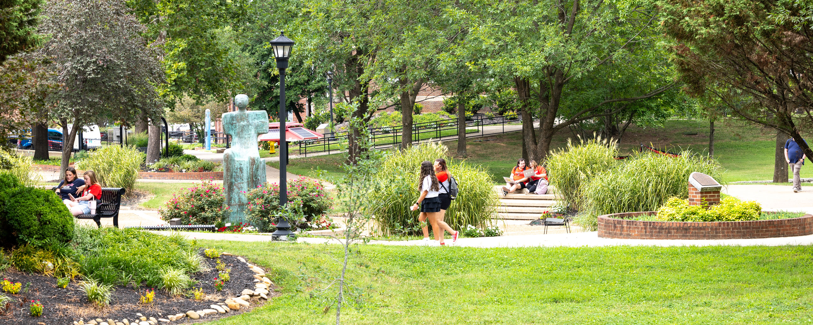 Campus scenic with students walking on campus